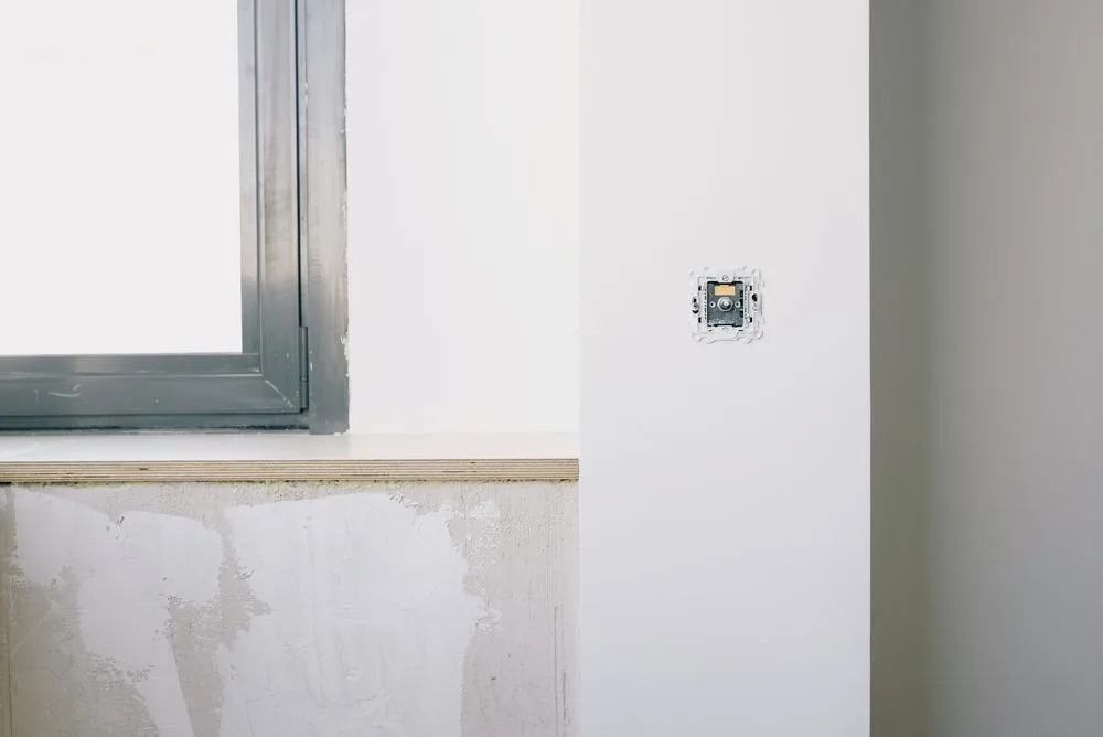 Electrical socket and switch installation — illustrative service photo